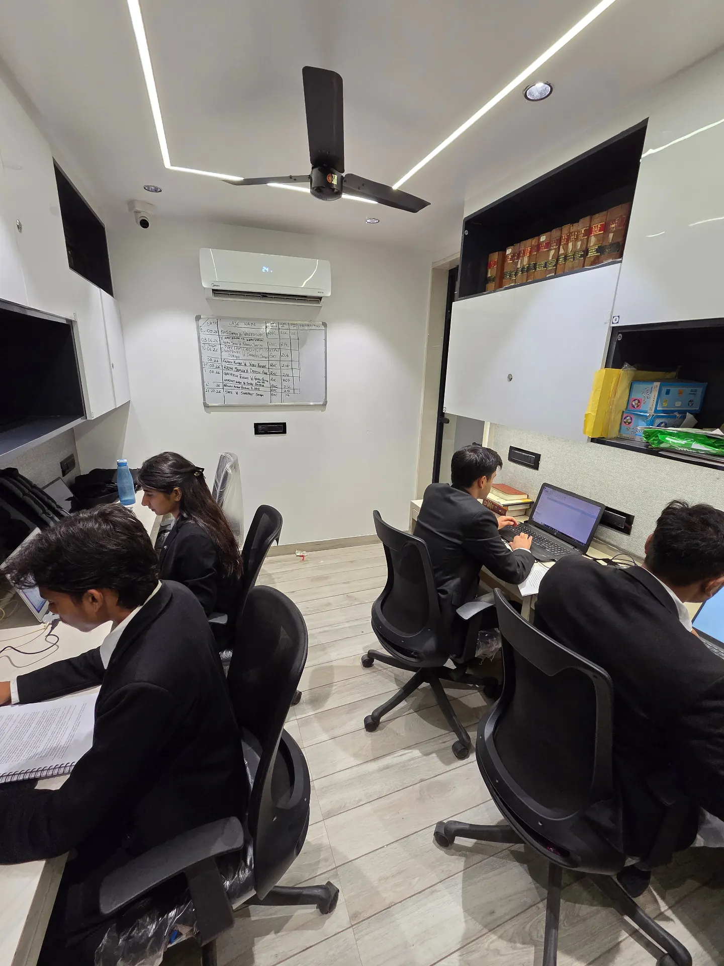 Samvid Law Chambers advocate reviewing case files at the Rohini Court office